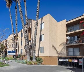 Toluca Lake apartment for rent - A building with a blue sign in front of it.
