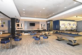 Private bowling lounge with billiard tables and seating