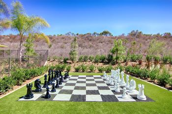 Giant outdoor chess board on artificial turf