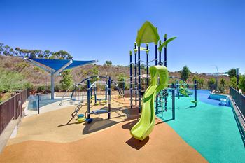 Playground with tower slide and splash pad