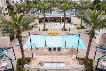Pool area with spa and playground beyond