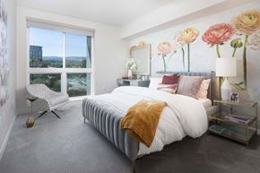 Irvine apartment for rent - Bedroom with floral wall mural and gray upholstered bed at Elements Apartments, California, 92612