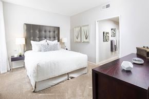 San Diego apartment for rent - Bedroom with tufted headboard and ensuite bathroom at La Jolla Crossroads Apartments, San Diego, California