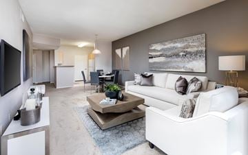 San Diego apartment for rent - A modern living room with a white couch and a coffee table.