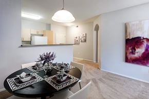 San Diego apartment for rent - Dining area with modern table setting and artwork at La Jolla Crossroads Apartments, California, 92122