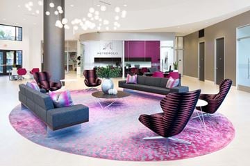 Irvine apartment for rent - A modern living room with a round sofa and chairs.