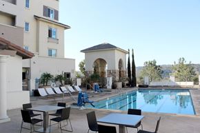 San Diego apartment for rent - Resort style pool with lounge chairs and cabana at Torrey Gardens Apartments, San Diego, California