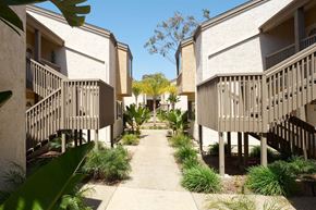 La Jolla apartment for rent - A row of houses with a concrete walkway between them.