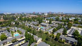 La Jolla apartment for rent - A bird's eye view of a residential area with houses and a pool.