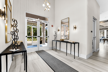 Roseland triplex for rent - A white room with a black table and a mirror.