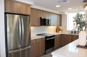 San Diego apartment for rent - Kitchen with wood cabinets and stainless steel appliances at Garden at 3Roots Apartments, San Diego, CA 92126