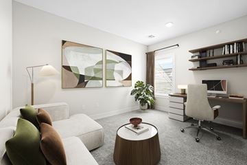 New Providence townhouse for rent - A modern living room with a white couch, a wooden coffee table, and a large abstract painting on the wall.