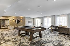 Hackensack apartment for rent - A room with a pool table and a couch.
