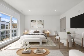 Englewood Cliffs apartment for rent - A modern studio bedroom with a large bed and a window.