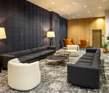 Modern lounge with paneled walls and contemporary seating