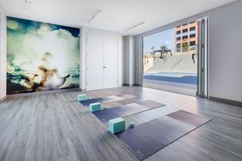 Yoga studio with mats and ocean mural