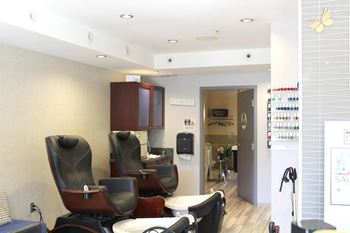 Nail salon pedicure station with massage chairs
