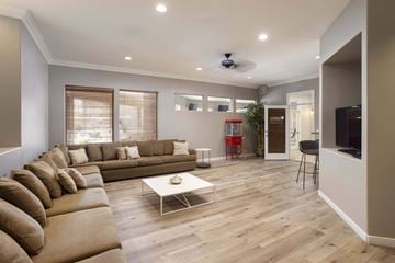 Scottsdale apartment for rent - A living room with a brown sofa and a white coffee table.