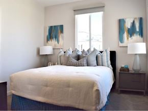 San Diego apartment for rent - Bedroom with abstract art and upholstered bench at 360 Luxury Apartments, San Diego, California