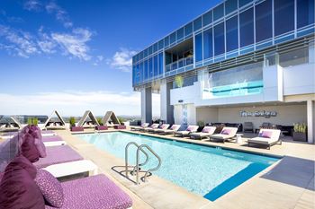 The edge resort-style pool with cabanas, spa deck, kitchen & barbeques