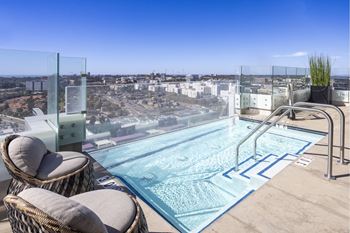 The edge resort-style pool with cabanas, spa deck, kitchen & barbeques