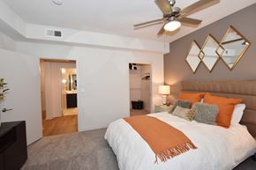 Irvine apartment for rent - Bedroom with ceiling fan and walk-in closet at Metropolis Apartments, IRVINE, CA