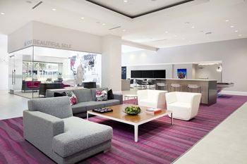 Bright lobby area with modern seating and striped carpet