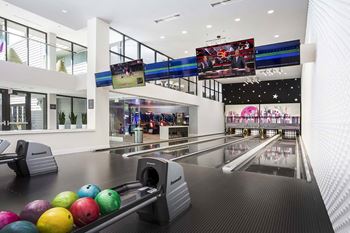 Bowling alley with colorful balls and multiple lanes