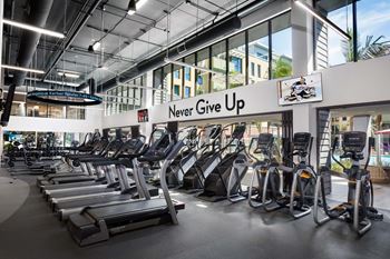Fitness center with cardio equipment and motivational signage
