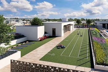 Rooftop fitness lawn with yoga mats and training lanes