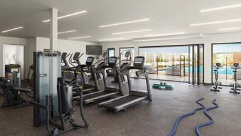 Fitness center with cardio equipment and pool view