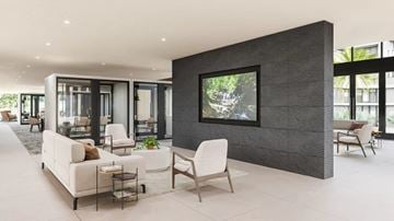 Irvine apartment for rent - A modern living room with a white sofa set and a large painting on the wall.