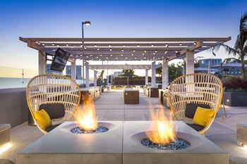Rooftop terrace with fire pits and pergola lighting