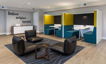 Community lounge with booth seating and modern furniture