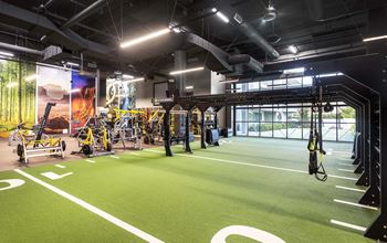 Fitness center with turf training area and equipment