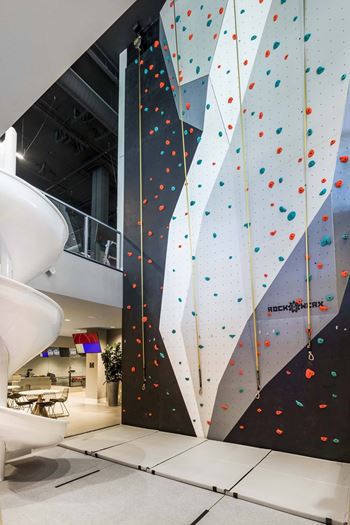 Indoor rock climbing wall with colorful holds