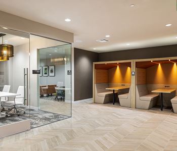 Conference room and private booth seating with warm lighting