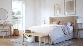 Newton apartment for rent - A bedroom with a large bed, a desk with a chair, and a nightstand.