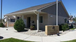 Laramie apartment for rent - A building with a sign that says "Ascension Retreat" in front of it.