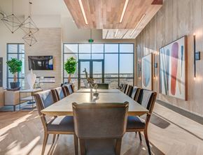 West Point apartment for rent - A modern dining room with a long table and chairs.