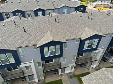 Clearfield townhouse for rent - Apartment complex with grey roofs and multiple balconies.