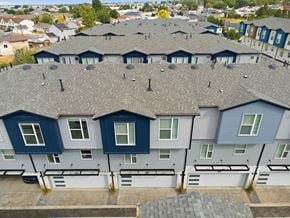 Clearfield townhouse for rent - A row of houses with grey roofs and blue and white walls.