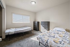 Saint George apartment for rent - A bedroom with two beds and a dresser.