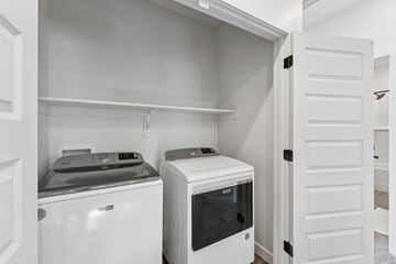 Clearfield townhouse for rent - A white kitchen with a dishwasher and a microwave.