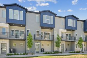 Clearfield townhouse for rent - Apartment building with balconies and trees in front.