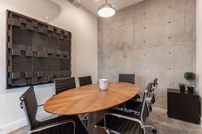 Provo apartment for rent - a meeting room with a wooden table and chairs