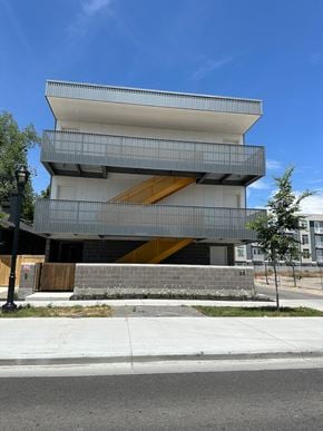 Salt Lake City apartment for rent - the front of a building with a blue sky background