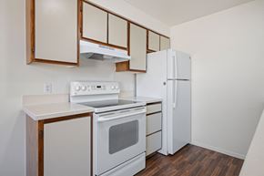 St.George apartment for rent - a kitchen with white appliances and wood flooring and a refrigerator