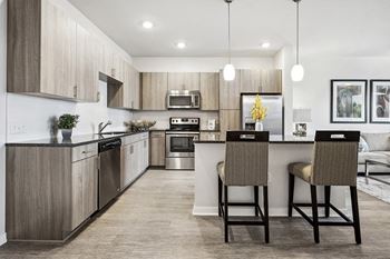 Gray-toned wood cabinets with modern hardware