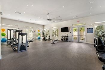24-Hour fitness center with cardio and weight training equipment